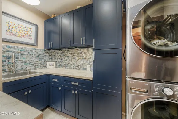 a kitchen with a sink and a stove