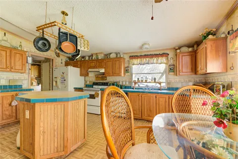 a very nice looking kitchen with a large window