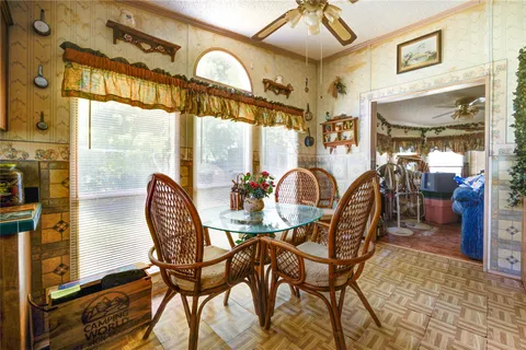 a view of a dining room with furniture window and outside view