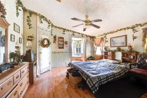 a kitchen with stainless steel appliances granite countertop a stove and a wooden floors