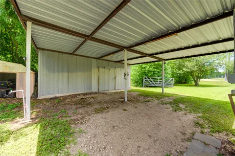 a view of a backyard with large trees