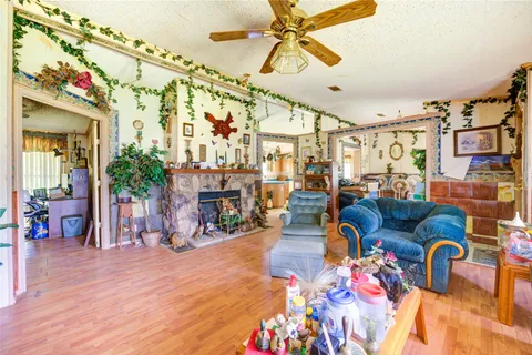 a living room filled with furniture and a chandelier