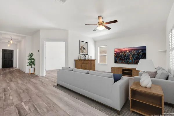 a living room with furniture and a flat screen tv