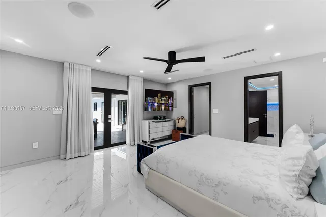 a bathroom with a double vanity sink toilet and shower