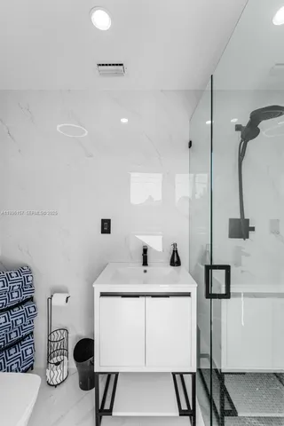 a outdoor dining space with a table and chairs