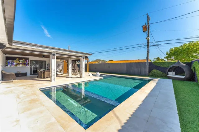 a view of house with swimming pool