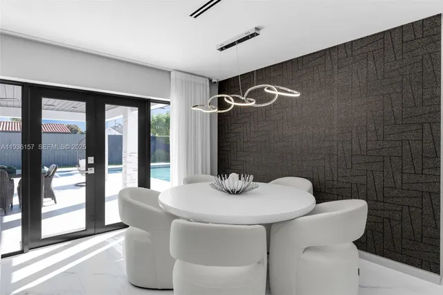 a kitchen with stainless steel appliances a sink and a refrigerator