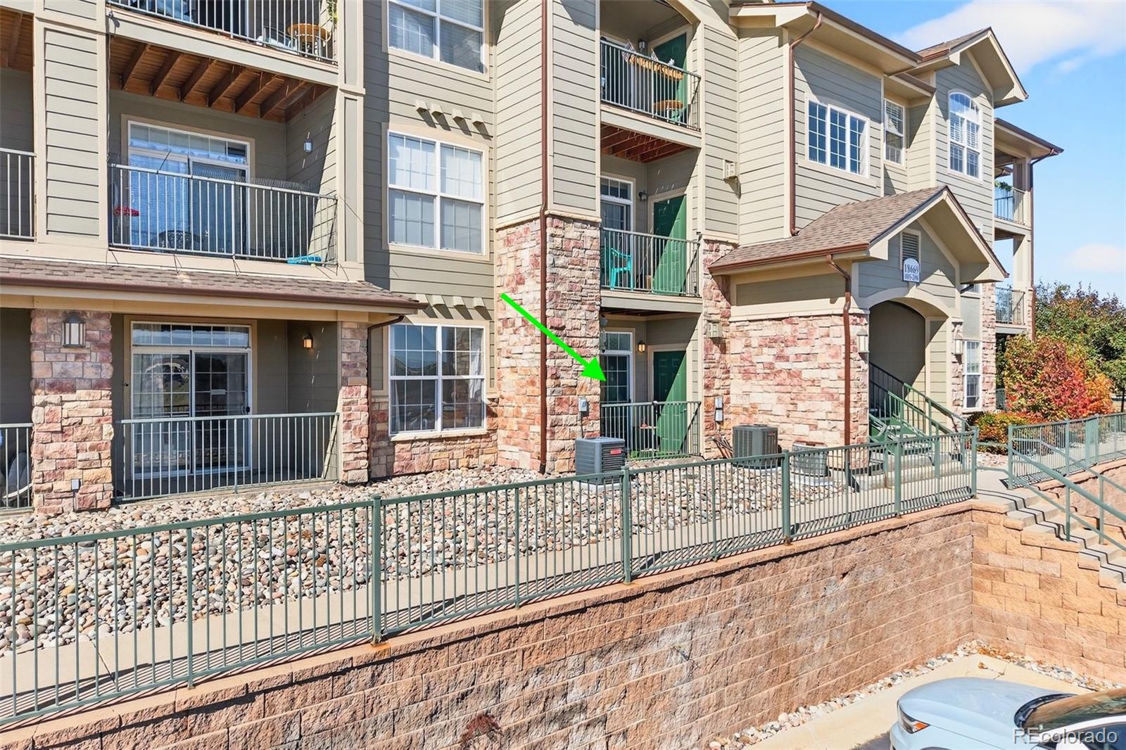 18669 Stroh Road, Unit 10005 Parker, CO 80134 - Photo 2 of 18 a view of a brick building next to a yard
