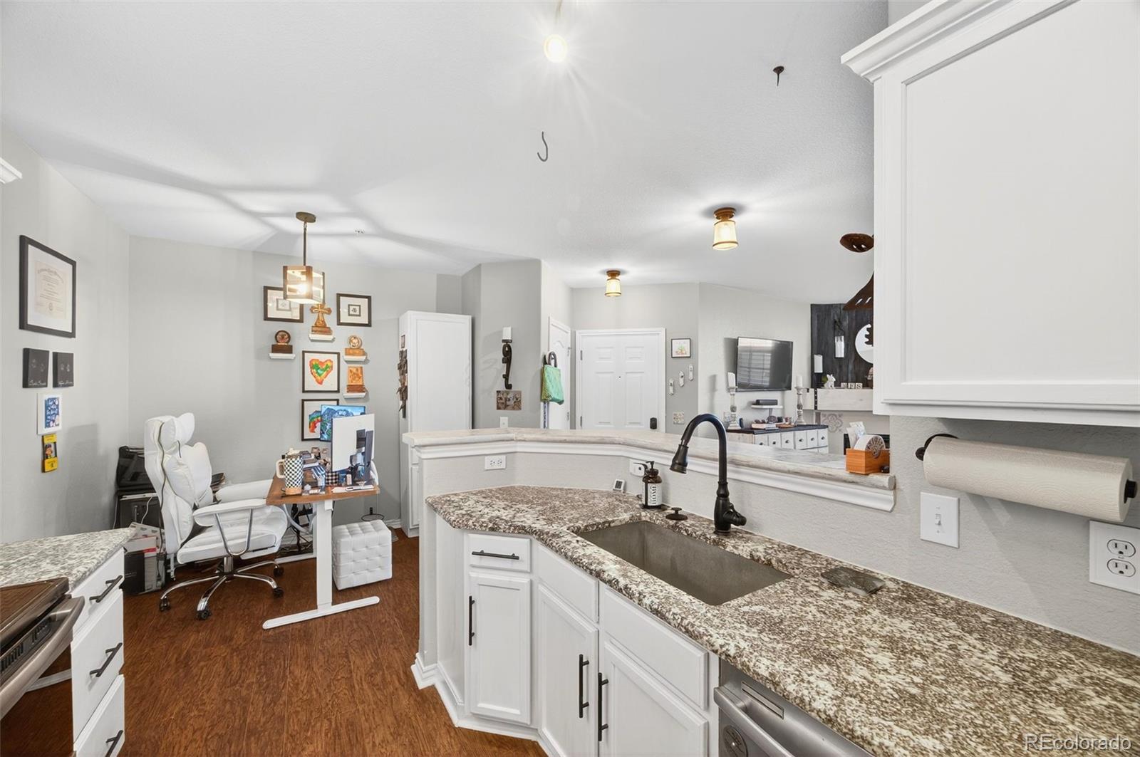 18669 Stroh Road, Unit 10005 Parker, CO 80134 - Photo 7 of 18 a kitchen with sink and cabinets