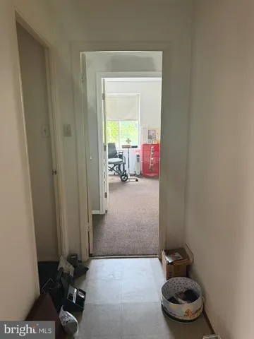 a view of a livingroom with furniture and a window