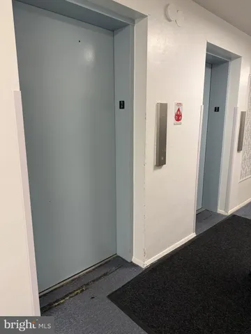 a living room with furniture wooden floor and a table