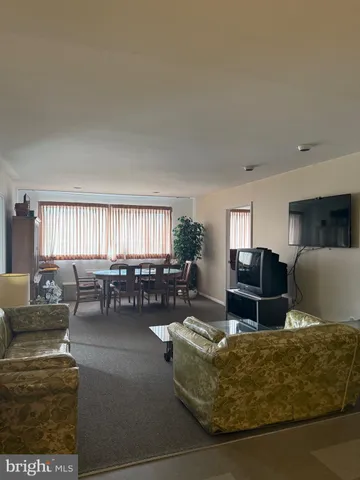 a view of a closet area with wooden floor