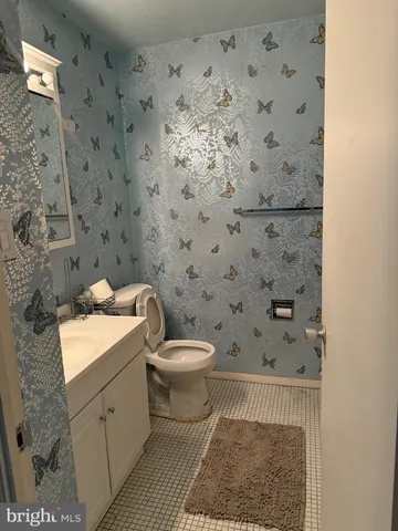 a bed sitting in a room next to a window