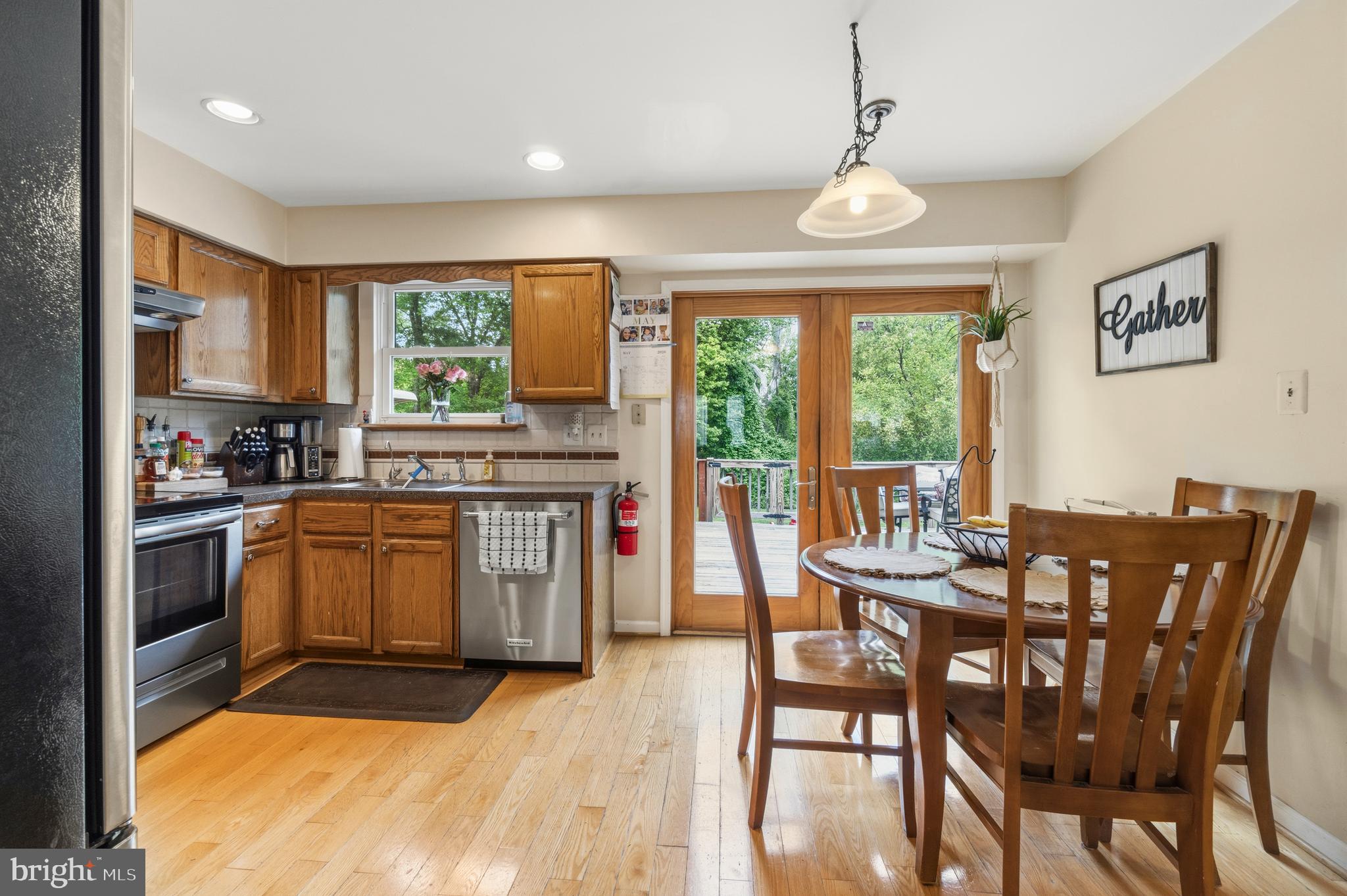2 Farnham Court Laurel Springs, NJ 08021 - Photo 8 of 33 a kitchen with granite countertop stainless steel appliances a dining table and chairs