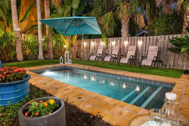 a view of a backyard with sitting area