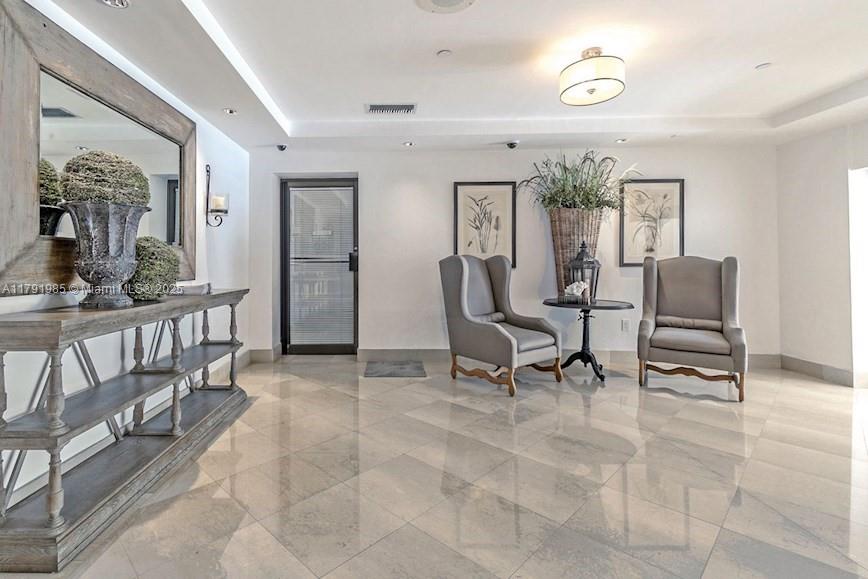 575 Crandon Boulevard, Unit 307 Key Biscayne, FL 33149 - Photo 23 of 37 a view of a livingroom with furniture and window