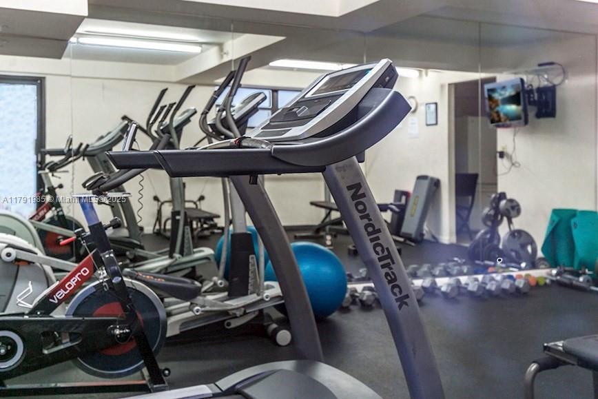 575 Crandon Boulevard, Unit 307 Key Biscayne, FL 33149 - Photo 25 of 37 a view of a room with gym equipment