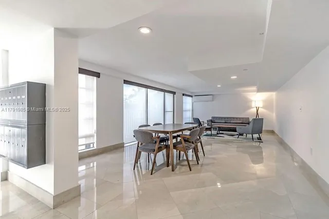 a living room with furniture a dining table and chairs