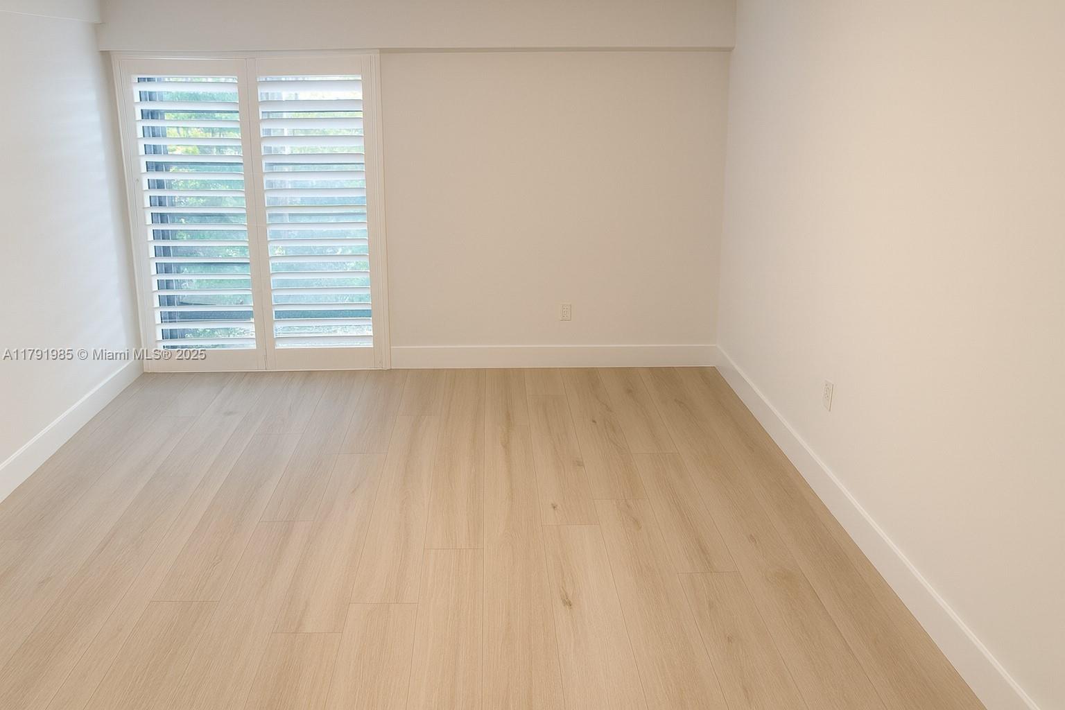 575 Crandon Boulevard, Unit 307 Key Biscayne, FL 33149 - Photo 5 of 37 a view of an empty room with a window