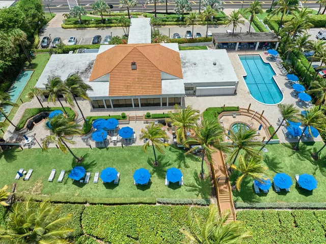 a view of a terrace with chairs and potted plants