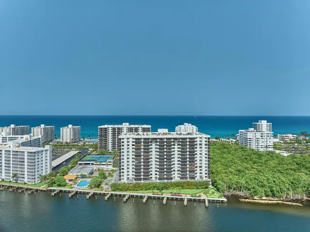a bedroom with a large bed couch and a window