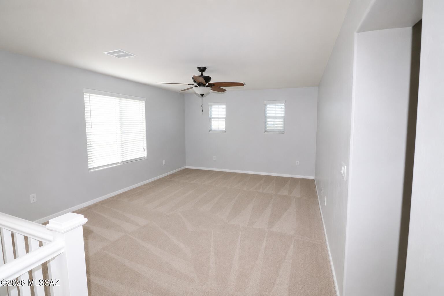 11484 East Desert Raptor Loop Tucson, AZ 85747 - Photo 20 of 28 a view of an empty room with a window
