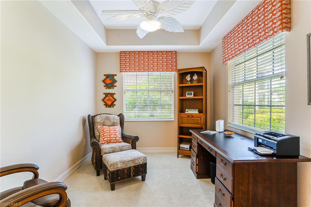 8609 Champions Point, Unit 201 Naples, FL 34113 - Photo 6 of 25 a living room with furniture and a window