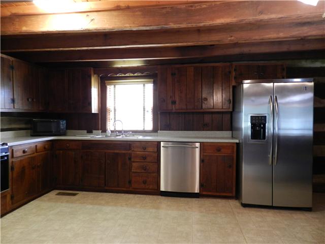275 Rock Bridge Road Gallatin, TN 37066 - Photo 4 of 16 a kitchen with stainless steel appliances granite countertop a refrigerator and a sink