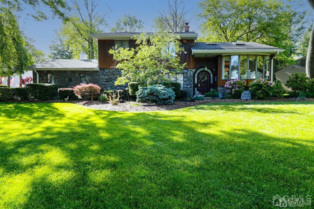 a front view of a house with garden