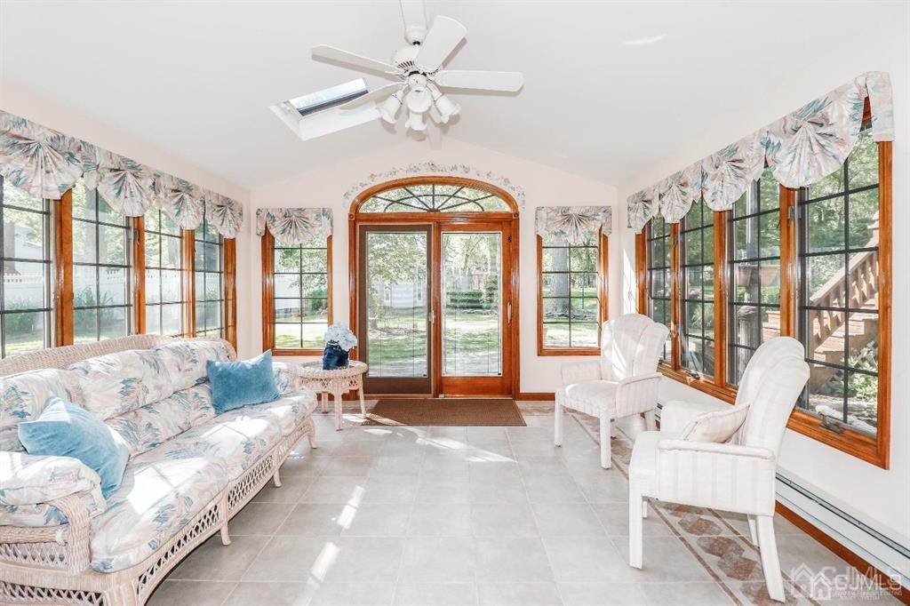 164 Devon Road Colonia, NJ 07067 - Photo 20 of 42 a living room with furniture and a large window