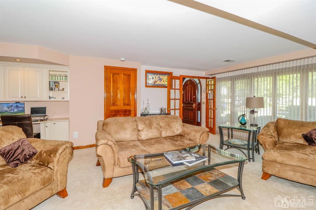 164 Devon Road Colonia, NJ 07067 - Photo 24 of 42 a living room with furniture and a large window