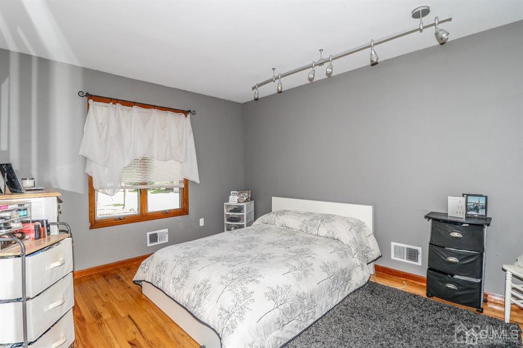 164 Devon Road Colonia, NJ 07067 - Photo 28 of 42 a bedroom with a bed and a window