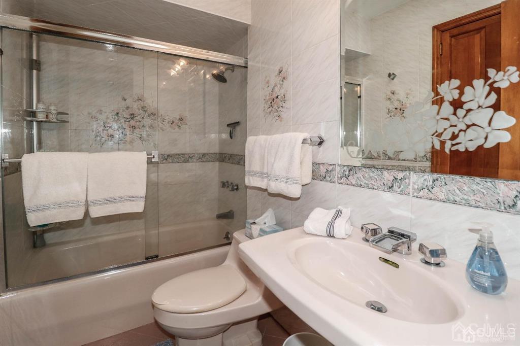 164 Devon Road Colonia, NJ 07067 - Photo 30 of 42 a bathroom with a sink toilet and shower