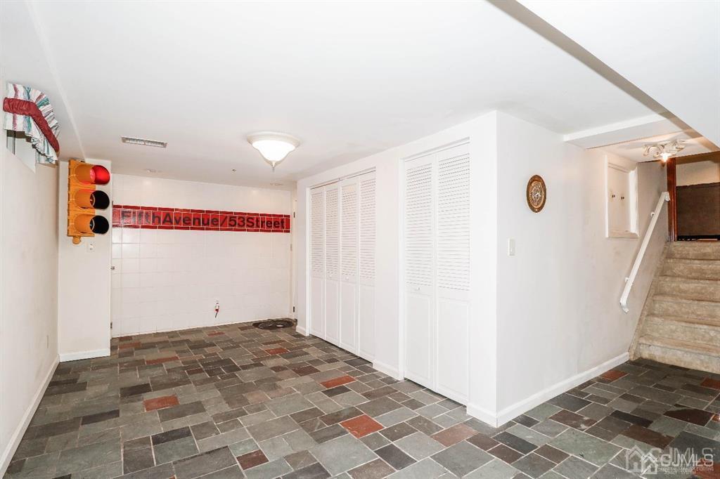 164 Devon Road Colonia, NJ 07067 - Photo 31 of 42 a view of a livingroom with wooden floor and hallway