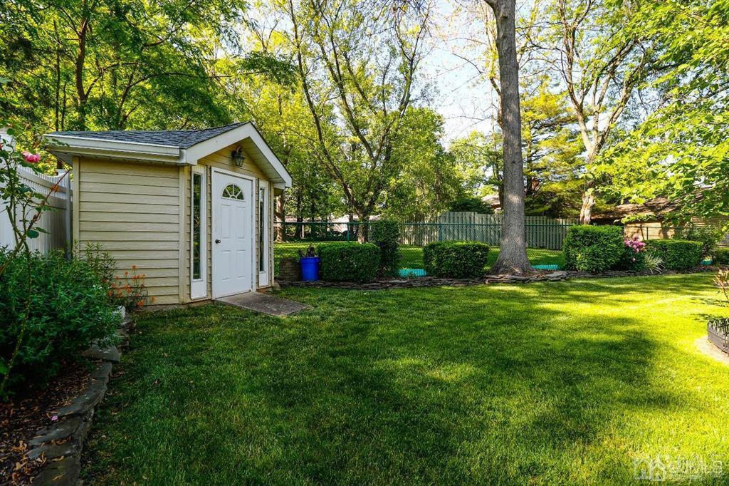 164 Devon Road Colonia, NJ 07067 - Photo 39 of 42 a front view of house with yard and green space
