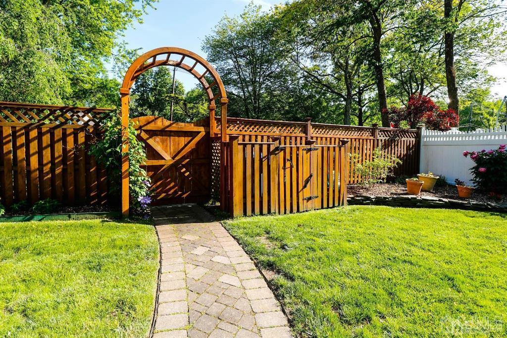 164 Devon Road Colonia, NJ 07067 - Photo 40 of 42 a view of swimming pool with a backyard and trees