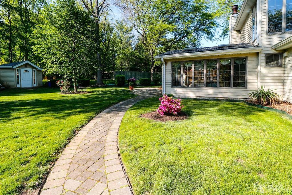 164 Devon Road Colonia, NJ 07067 - Photo 41 of 42 a front view of a house with garden