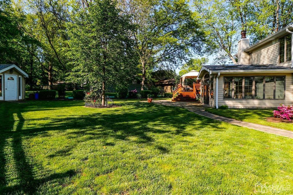 164 Devon Road Colonia, NJ 07067 - Photo 42 of 42 a view of a house with a big yard and large trees