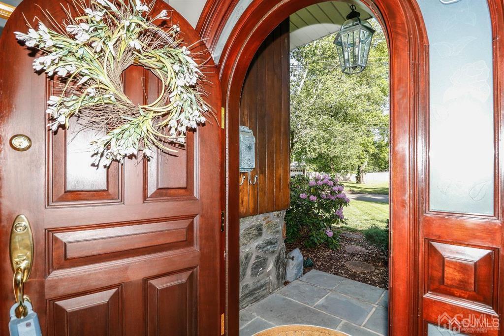 164 Devon Road Colonia, NJ 07067 - Photo 7 of 42 a vase of flowers sitting on a table next to a window