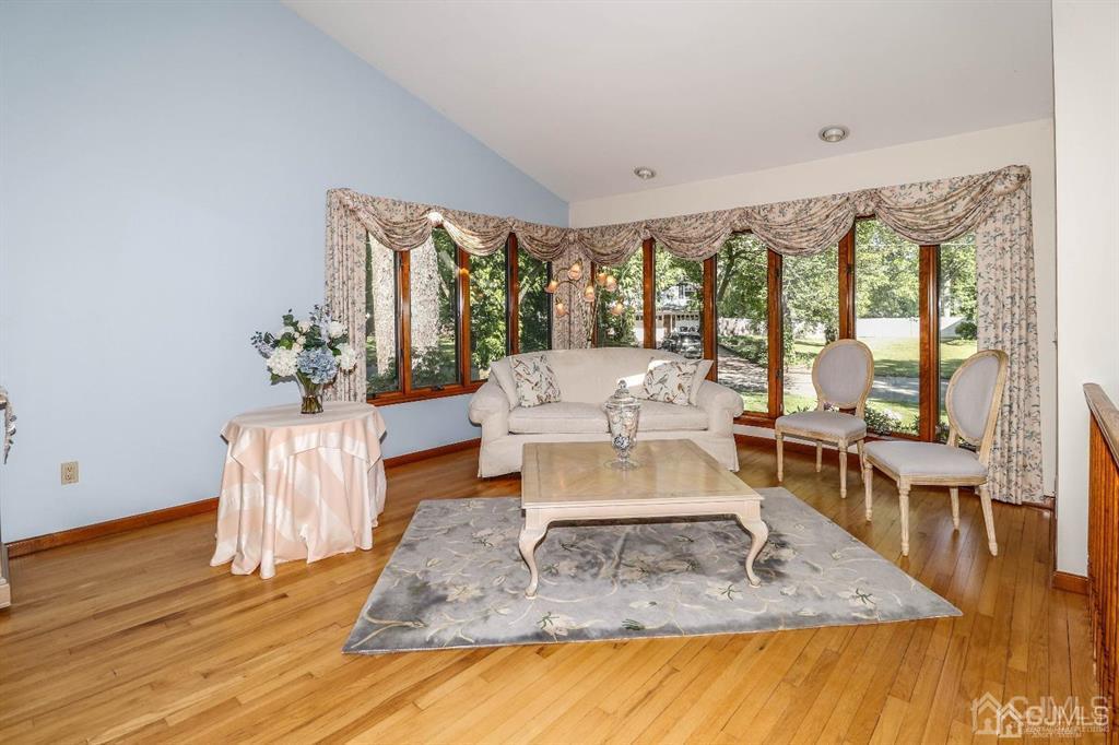 164 Devon Road Colonia, NJ 07067 - Photo 9 of 42 a living room with furniture and a large window