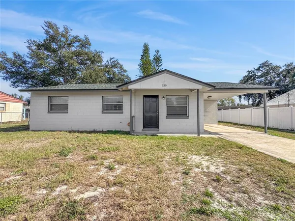a house with trees in the background