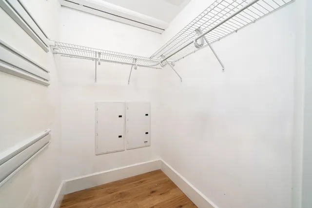 a room with pool table and windows