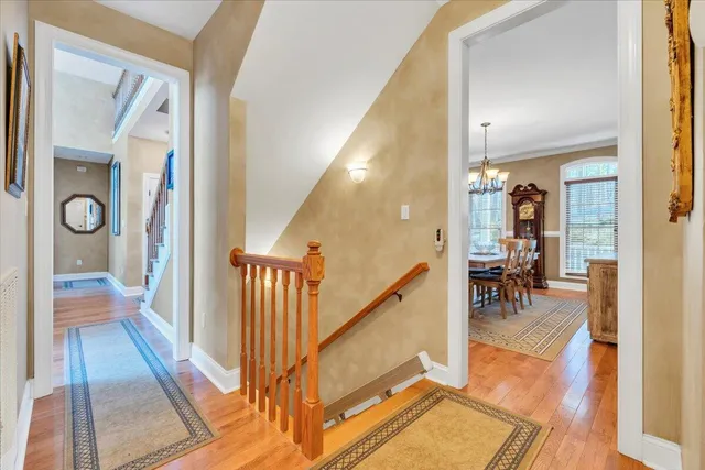 a view of a dining room with furniture and chandelier