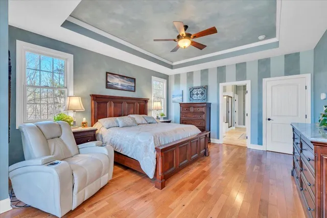 a living room with furniture a rug and a chandelier