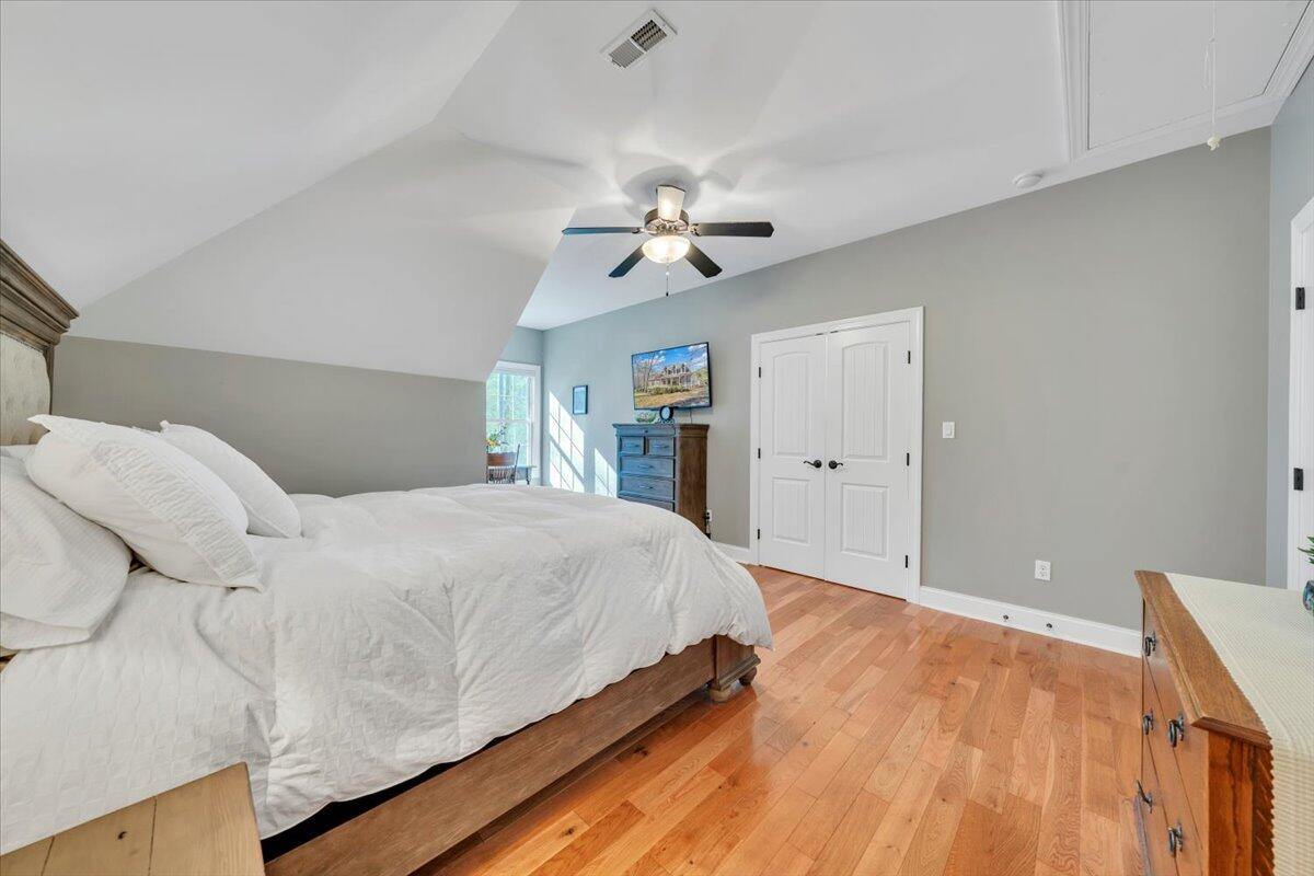 5565 Carons View Lane Roanoke, VA 24014 - Photo 61 of 118 a bedroom with a large bed and a chandelier