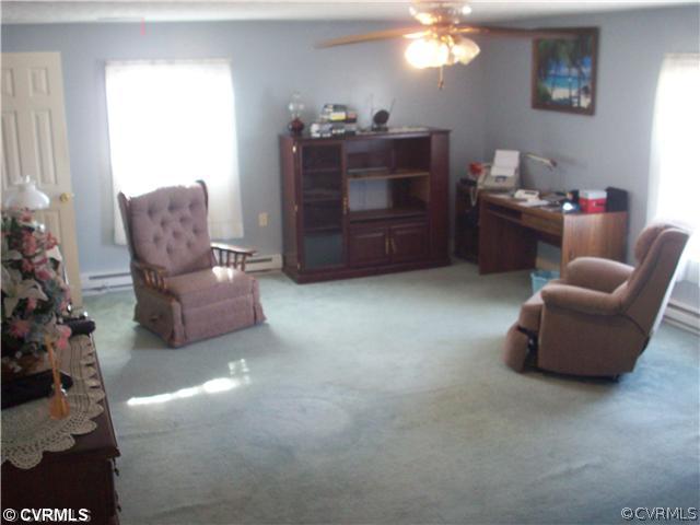 7384 Adams Farm Road Mechanicsville, VA 23111 - Photo 5 of 11 a living room with furniture and a chandelier
