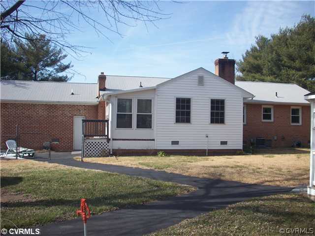 7384 Adams Farm Road Mechanicsville, VA 23111 - Photo 6 of 11 a view of a house with backyard and sitting area