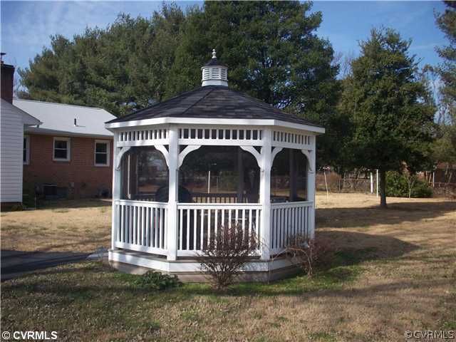 7384 Adams Farm Road Mechanicsville, VA 23111 - Photo 7 of 11 a view of a house with a yard