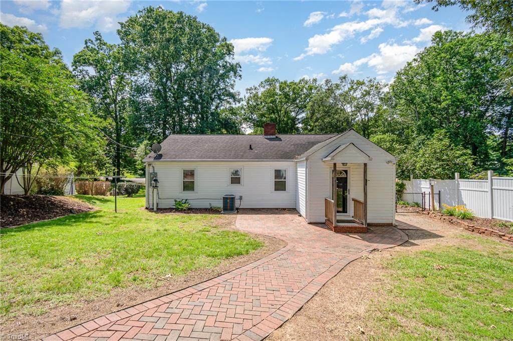 208 Rockspring Drive Thomasville, NC 27360 - Photo 25 of 28 Patio extends to a brick walkway to the storage building, check out the herringbone pattern.