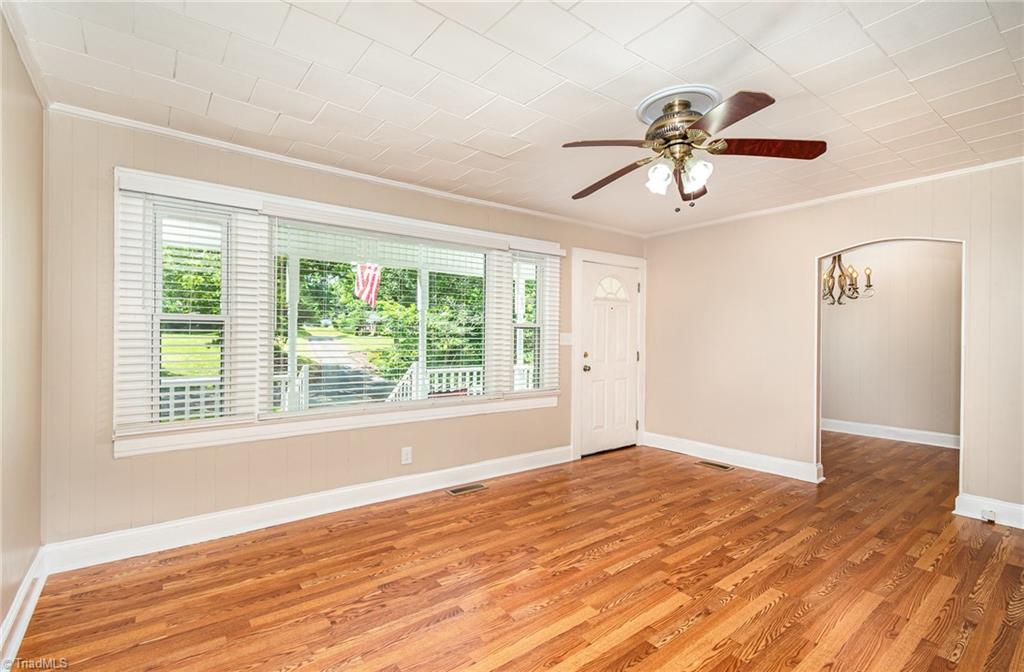 208 Rockspring Drive Thomasville, NC 27360 - Photo 6 of 28 New paint and laminate wood floors throughout. Arched doorways and plenty to light from large front windows.